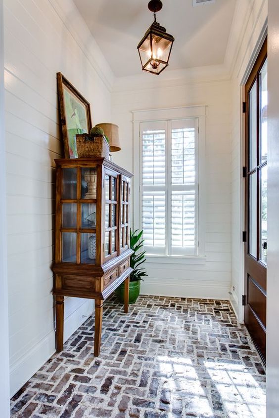 Brick floor - love - Smythe Park Home in Daniel Island, SC by JacksonBuilt Custom Homes