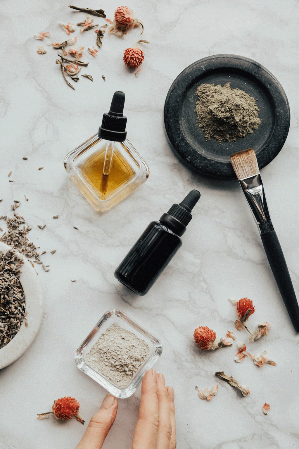 Woman making essential oils on her kitchen counter