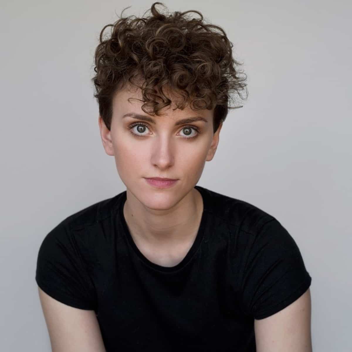 Curly brunette pixie cut